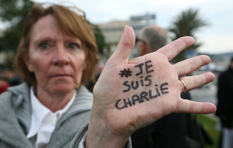 Brigitte Le Blein, of Nice, shows her hand reading ‘I am Charlie’ (Lionel Cironneau/AP)