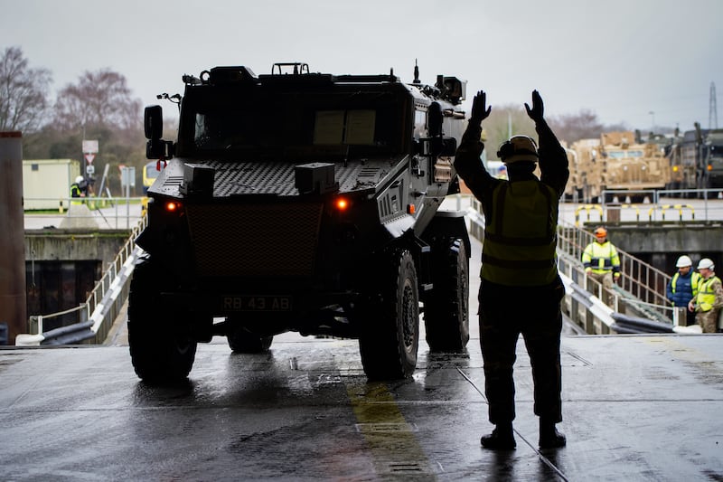 Vehicles and equipment are loaded onboard MV Anvil Point