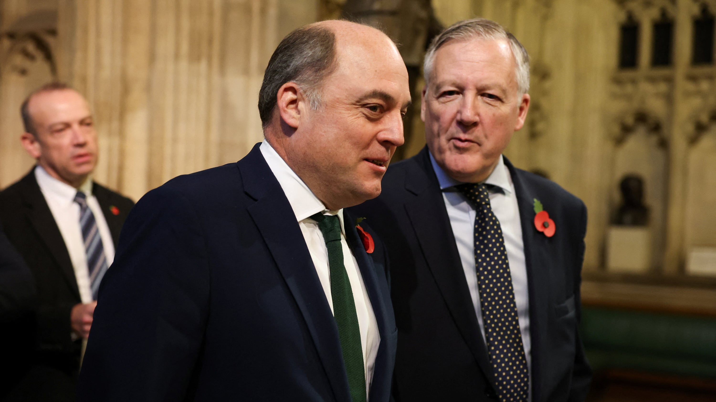 Ben Wallace (centre) walks through the Members’ Lobby at the Palace of Westminster following the State Opening of Parliament in the House of Lords, London