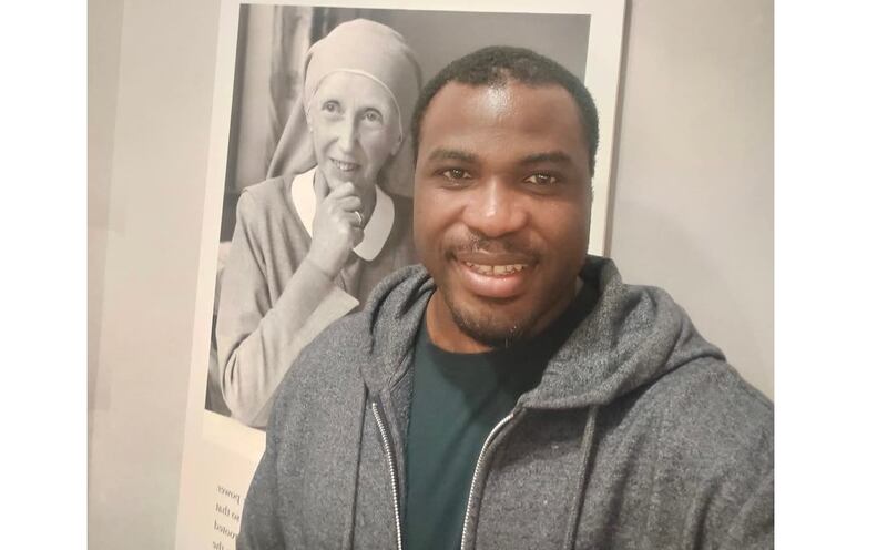 Dr Christian Oko pictured in front of a portrait of Sr Mary Martin, founder of the Medical Missionaries of Mary, an Irish group who devoted themselves to improving healthcare in Nigeria. PICTURE: CHRISTIAN OKO