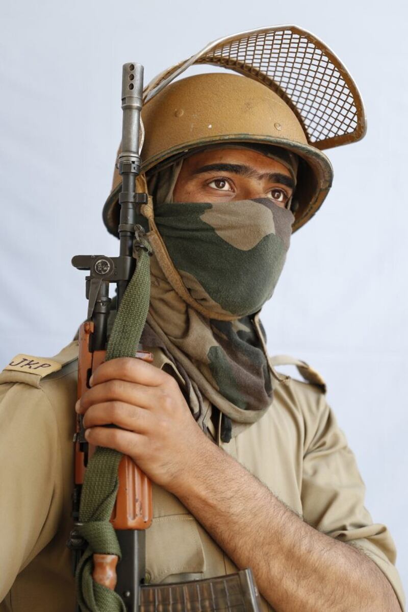 A member of the Indian security forces poses in Kashmir. Picture by Cathal McNaughton