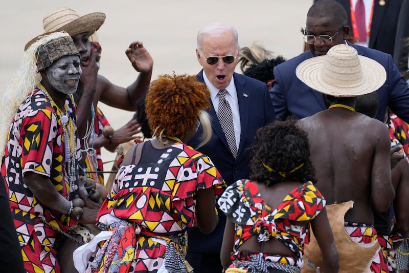 President Joe Biden watches a traditional dance after arriving at Catumbela airport in Angola (AP Photo/Ben Curtis)