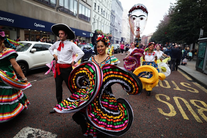 People taking part in the Belfast Mela Carnival Parade