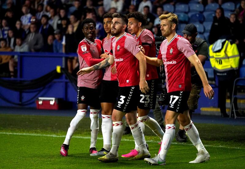 Che Adams (second left) celebrates with his team-mates after scoring the winner