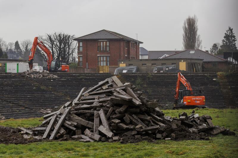 Contractors with excavators clear the concrete seating terraces at GAA stadium in Belfast