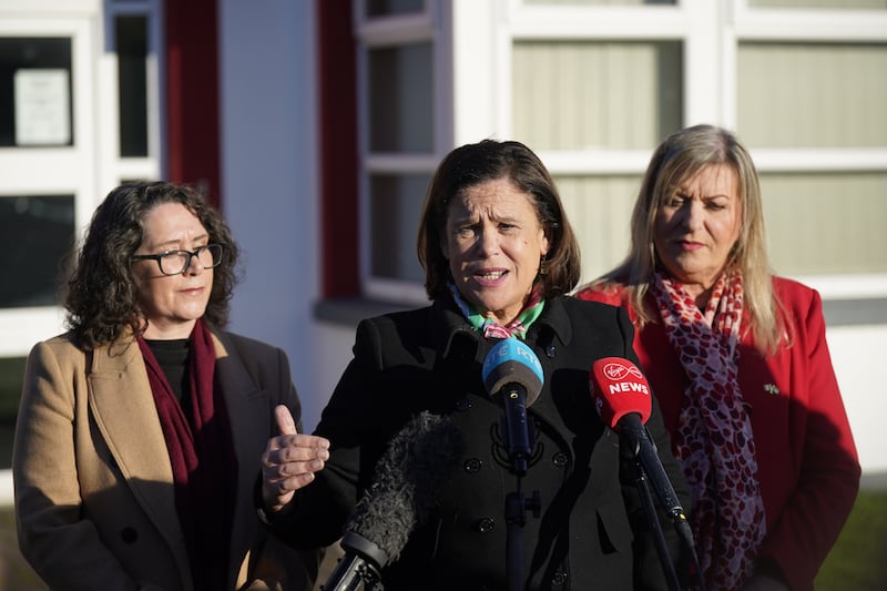 Sinn Fein leader Mary Lou McDonald (centre) speaks to the media at Naas Fire Station