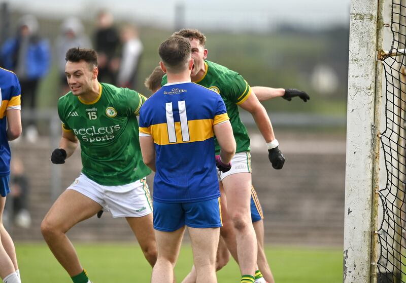 Kevin Barker of Dungannon turns to celebrates his sides first goal in the face of Phillip Donnellyof Donaghmore in the Tyrone GAA Senior Championship 1st round at Pomeroy