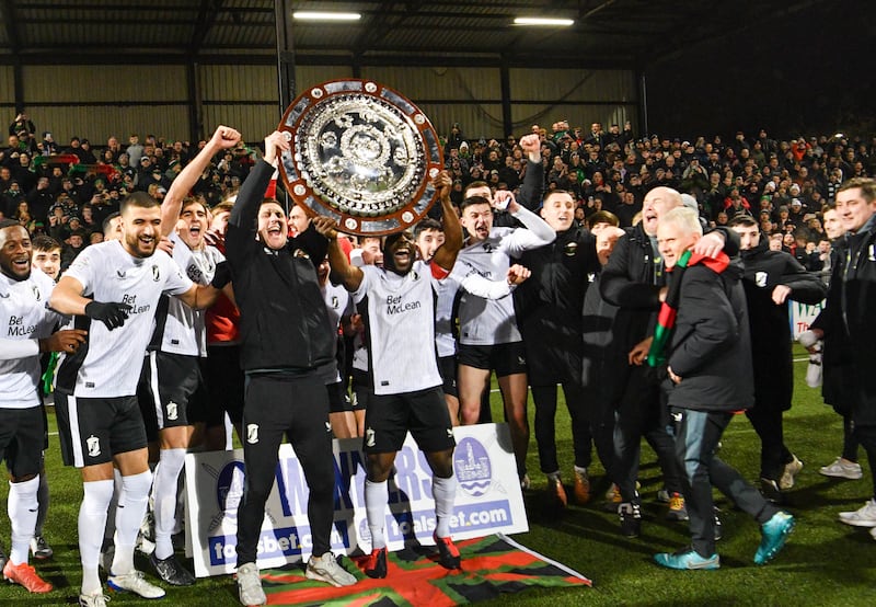 Fuad Sule of Glentoran lifts the Co Antrim Shield after this evening’s final at Seaview Stadium, Belfast