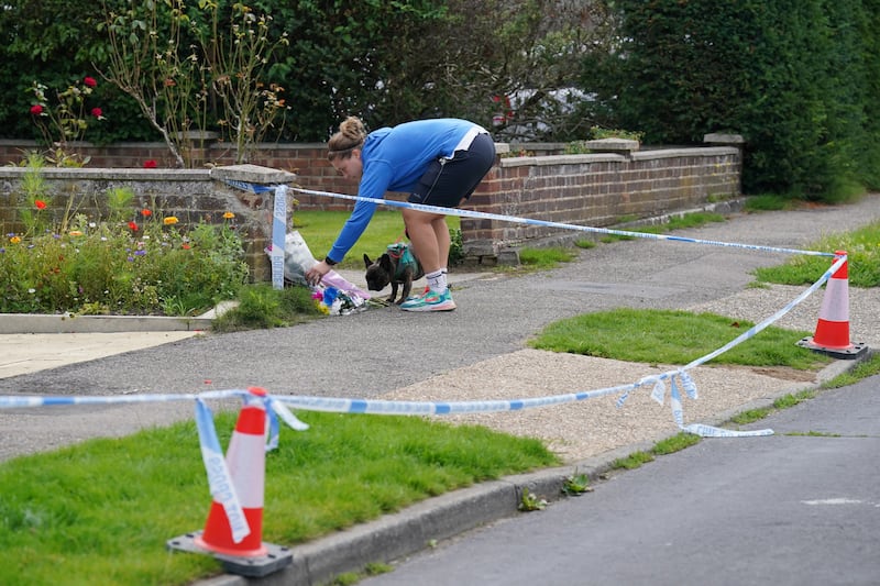 Floral tributes were left outside a property in Hammond Road, Woking, at the time of Sara’s death