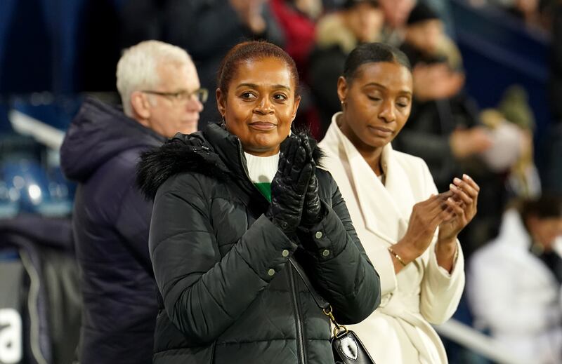 Julia Regis (centre) was introduced to golf by her late husband Cyrille, the former West Brom, Coventry, Aston Villa and England striker