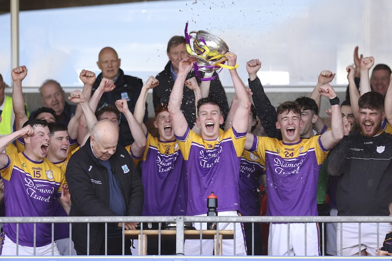 Derrygonnelly Harps captain Shane McGullion lifts the Fermanagh SFC trophy.