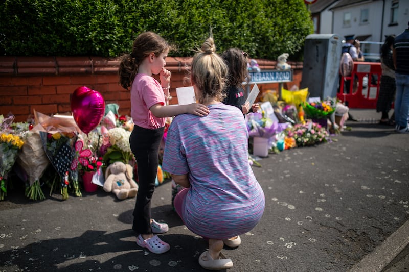 Families left tributes outside the police cordon after the attack