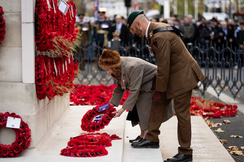 Henny Franks, 101, (left) Kindertransport survivor lays a wreath during the annual parade by AJEX, the Jewish Military Association