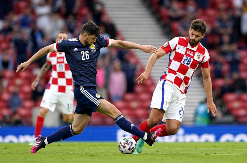 Scott McKenna (left) made a substitute appearance for Scotland at Euro 2020