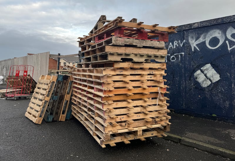 Pallets being collect for a eleventh night bonfire in the Sandy Road area south Belfast. PICTURE: MAL MCCANN