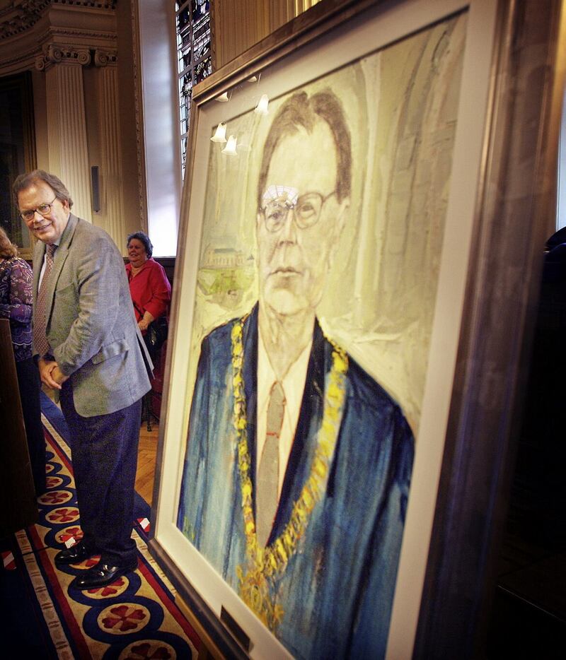 Former Lord Mayor of Belfast Tom Hartley looks at his portrait by JB Vallely at Belfast City Hall. PICTURE: HUGH RUSSELL 
