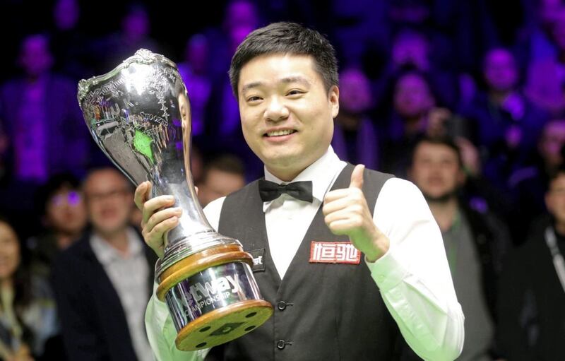 Ding Junhui celebrates after winning the Betway UK Championship at the York Barbican. 