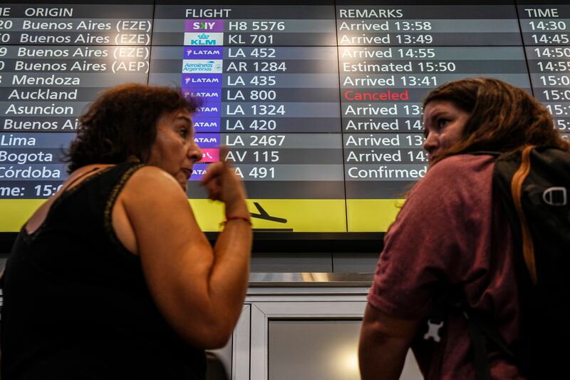 A digital display with arrivals times, lists LATAM Airlines flight LA800 as cancelled at the international airport in Santiago, Chile. At least 50 people were injured by what officials described as a “strong movement” on the Chilean plane traveling from Sydney to Auckland (AP)