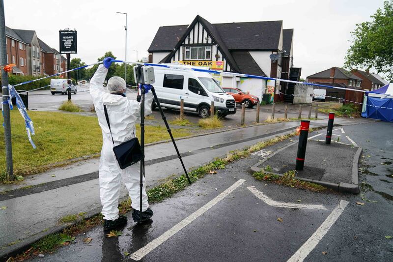 A scenes of crime officer in Well Lane, Walsall