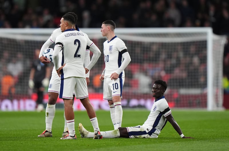 Bukayo Saka (right) sustained an injury while on international duty