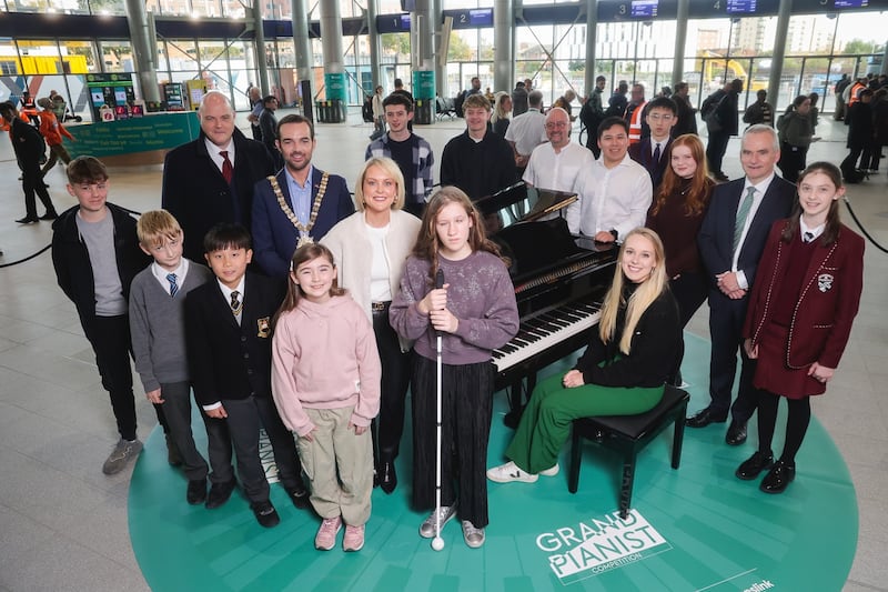 The pianists entertained passengers at the transport hub