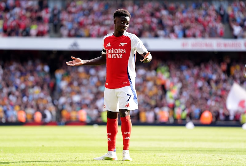 Bukayo Saka celebrates his goal against Wolves .