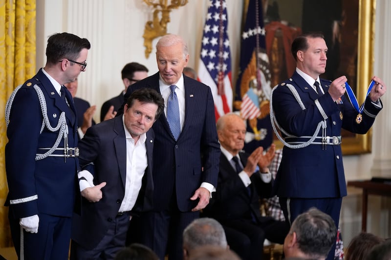 President Joe Biden with Michael J Fox (Manuel Balce Ceneta/AP)