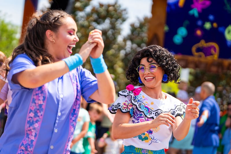 Mirabel appears in the ¡Celebración Encanto! sing-along show in CommuniCore Plaza at Walt Disney World Resort in Florida