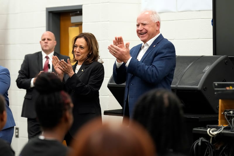 Kamala Harris and Tim Walz speak to marching band members at Liberty County High School in Hinesville, Georgia (Jacquelyn Martin/AP)