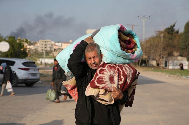 A man carrying his belongings flees the Israel offensive in Gaza (AP Photo/Hatem Ali)