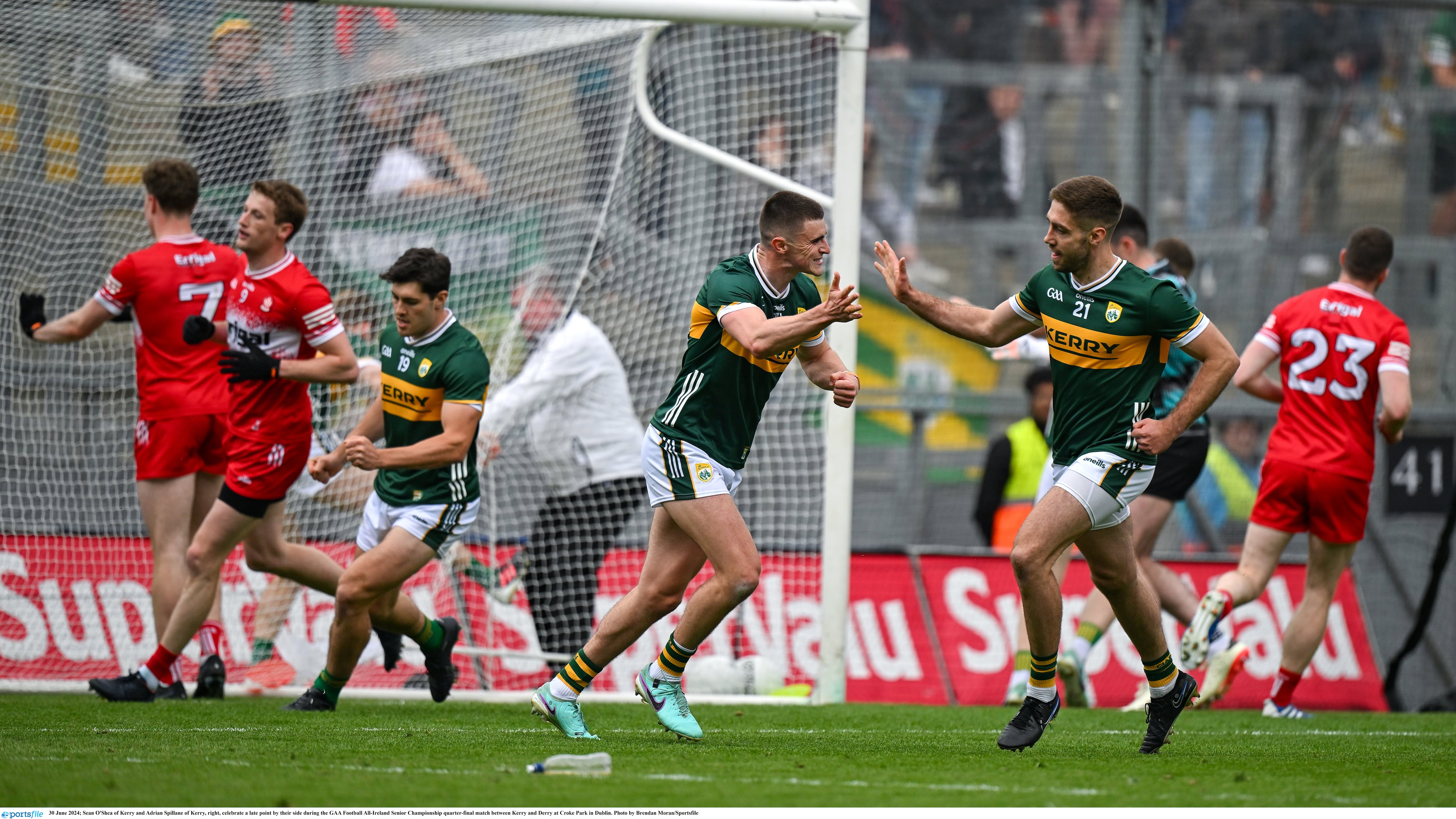 Sean O'Sheaand Adrian Spillane celebrate a late point as Kerry closed in on victory over Derry on Sunday. Picture by Brendan Moran/Sportsfile