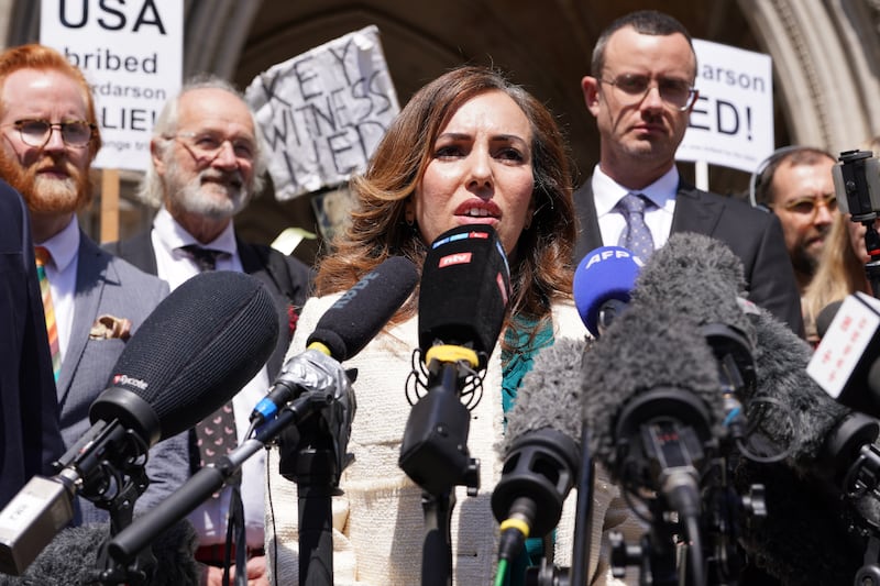 Stella Assange, wife of Julian Assange, giving a statement outside the Royal Courts of Justice in London