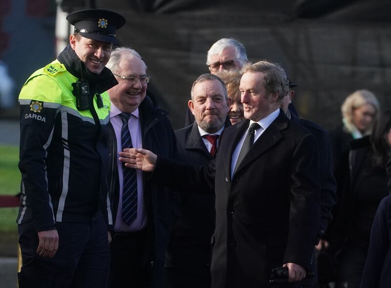 Enda Kenny (right) arrives for the funeral