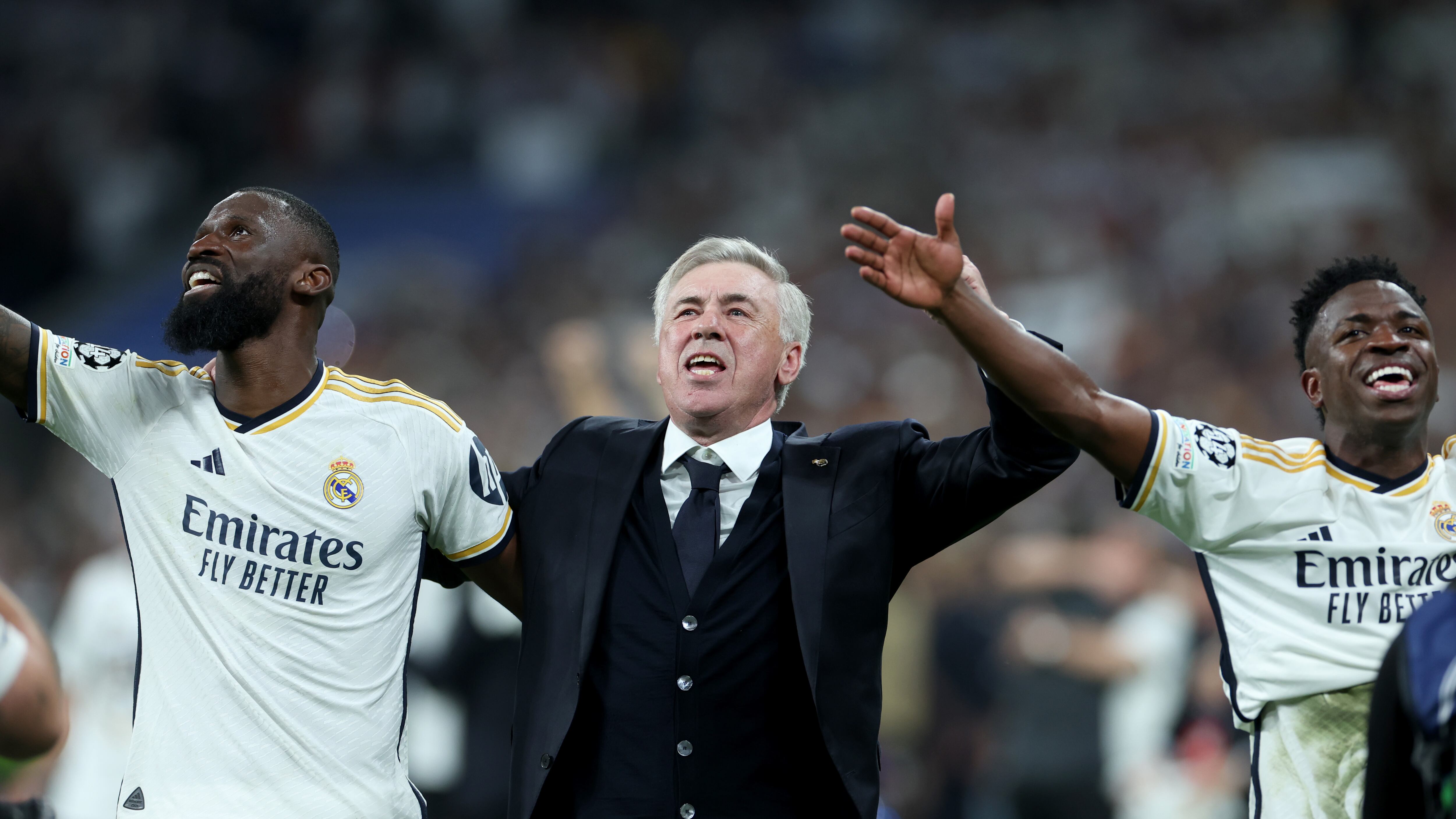 Real Madrid manager Carlo Ancelotti celebrates with Antonio Rudiger (left) and Vinicius Junior after their Champions League semi-final win over Bayern Munich.