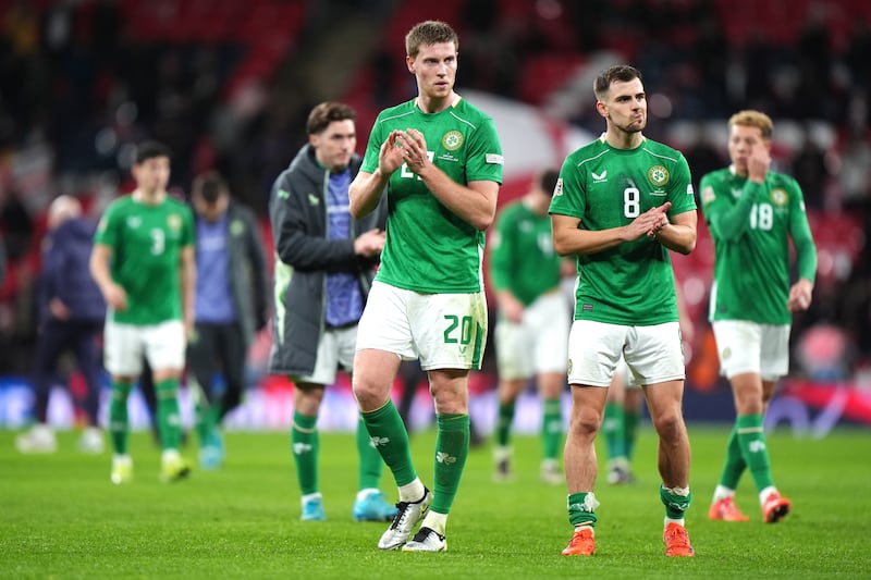 Jayson Molumby (right), Mark McGuinness (centre) and team-mates applaud the fans following defeat at Wembley