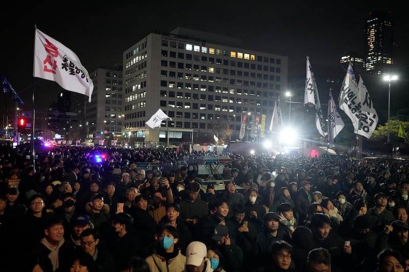 People gather in front of the National Assembly in Seoul (Ahn Young-joon/AP)