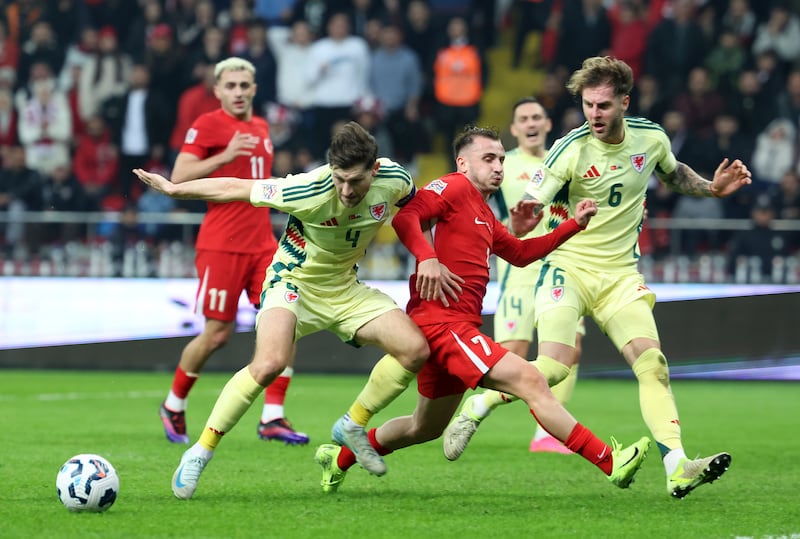 Joe Rodon, right, and Ben Davies, left, stop another Turkey attack in their 0-0 Nations League draw in Kayseri (Huseyin Yavuz/Dia Photo via AP)