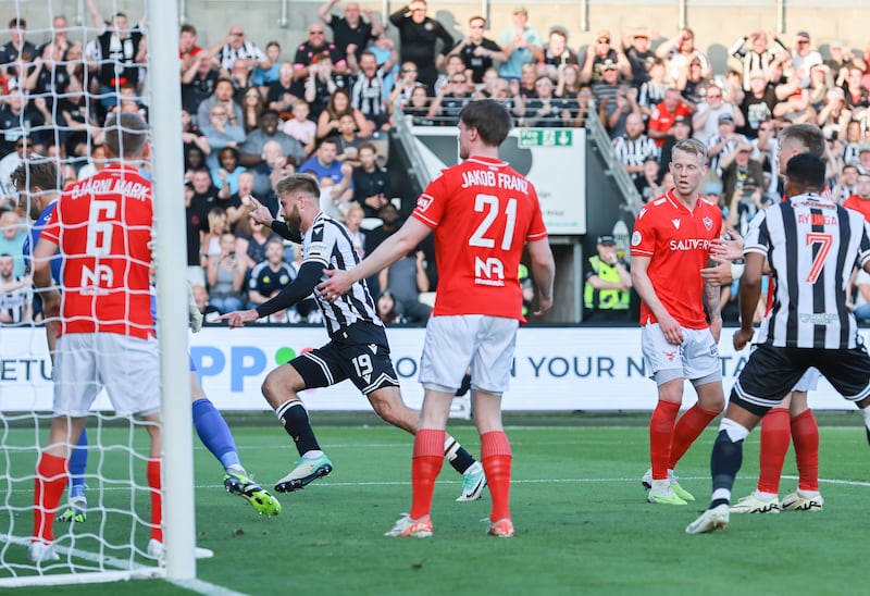 Shaun Rooney celebrates scoring on his debut against Valur