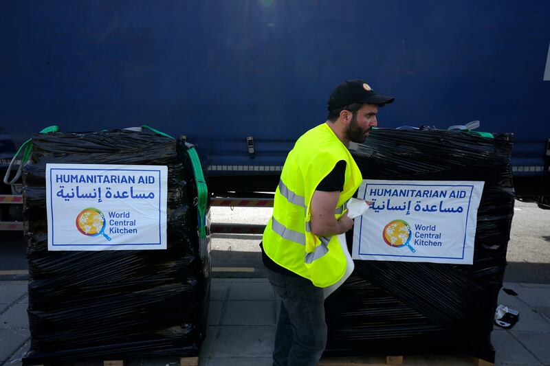 A member of the World Central Kitchen prepares a pallet with the humanitarian aid for transport to the port of Larnaca from where it was intended for shipping to Gaza (Petros Karadjias/AP)