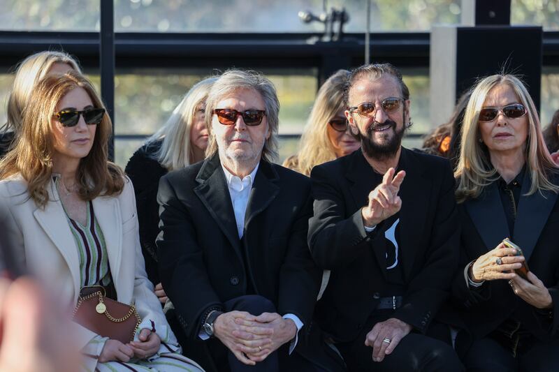 Nancy Shevell, from left, Sir Paul McCartney, Sir Ringo Starr and Barbara Bach attend the Stella McCartney show (Vianney Le Caer/Invision/AP)