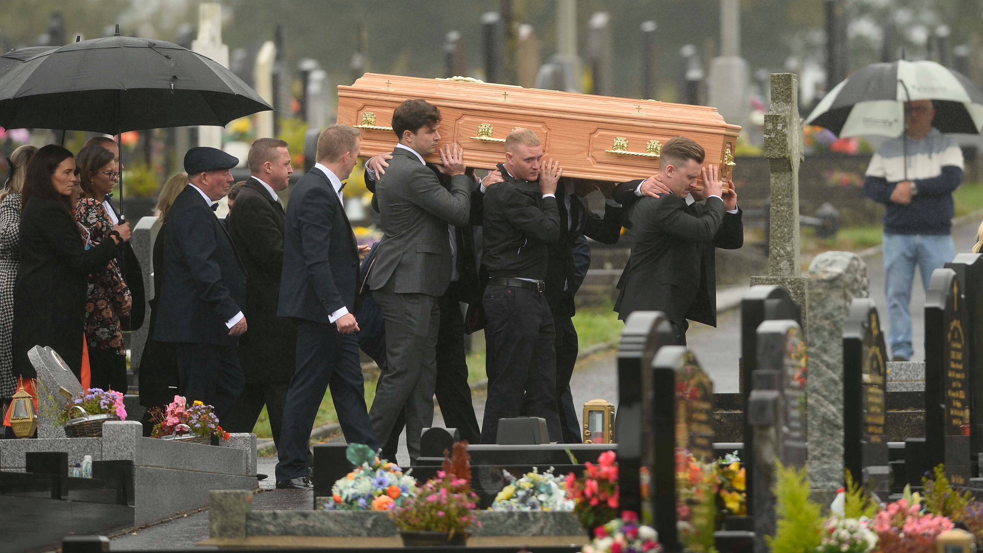 Mourners carry the coffin of Dr Sean McMahon following requiem mass in St Patricks Church, Cullyhanna, Co Armagh. Picture Mark Marlow