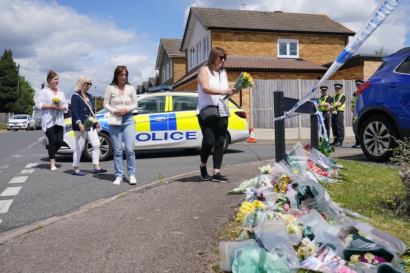 People leave flowers at Ashlyn Close, Bushey