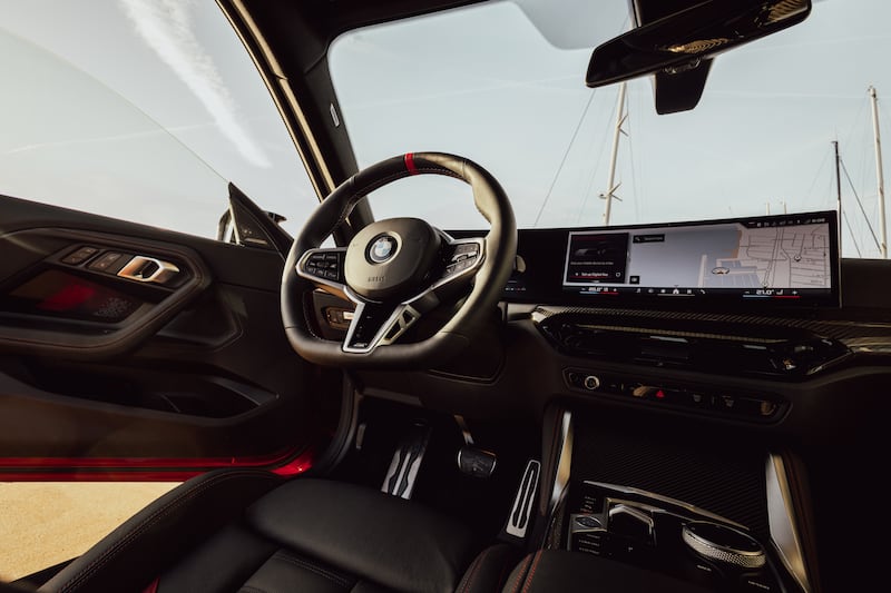 The interior retains the widescreen setup