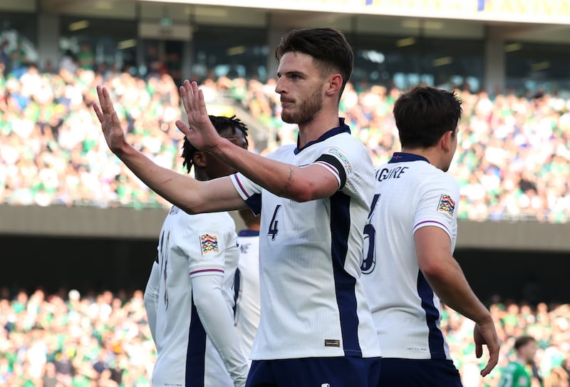 Declan Rice holds up his hands after scoring England’s opener .