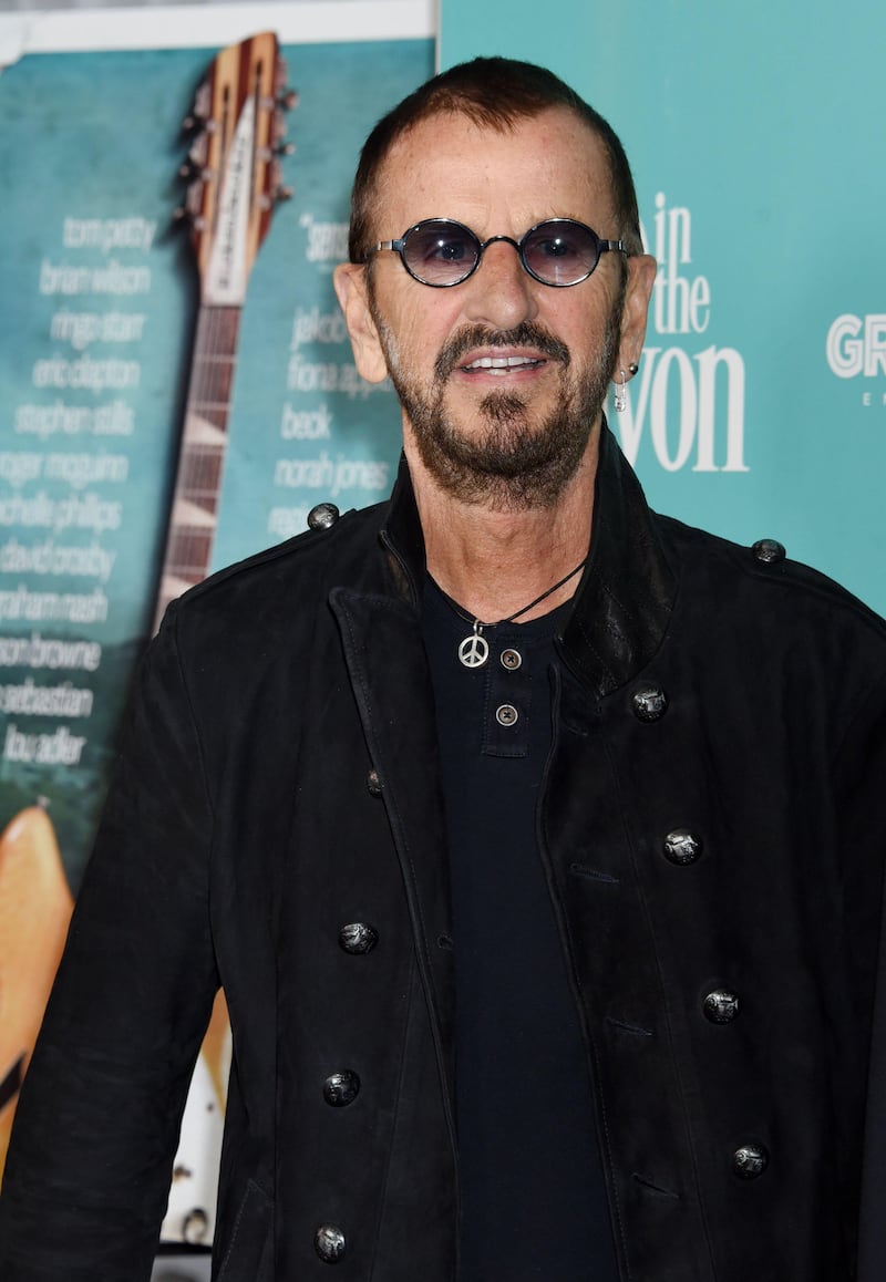 Ringo Starr later became known for his small round glasses and peace emblems