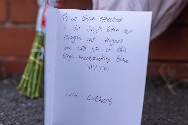 A card signed ‘Love – Southport’ near the scene of the fatal stabbings in Hart Street