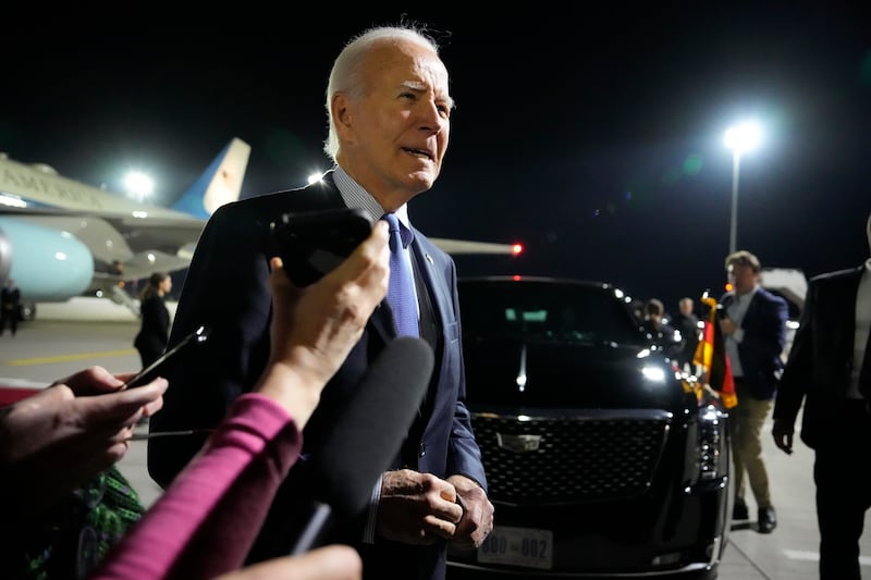 US President Joe Biden speaks to the media after arriving at Brandenburg Airport in Schoenefeld near Berlin (Ben Curtis/AP)