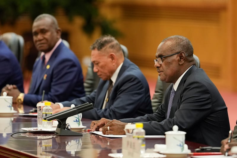 Solomon Islands’ Prime Minister Jeremiah Manele, right, headed the delegation (AP)