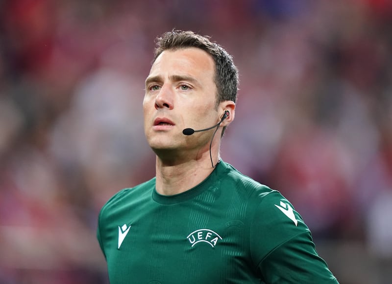 Referee Felix Zwayer warming up before the UEFA Europa Conference League semi-final between Olympiacos and Aston Villa.