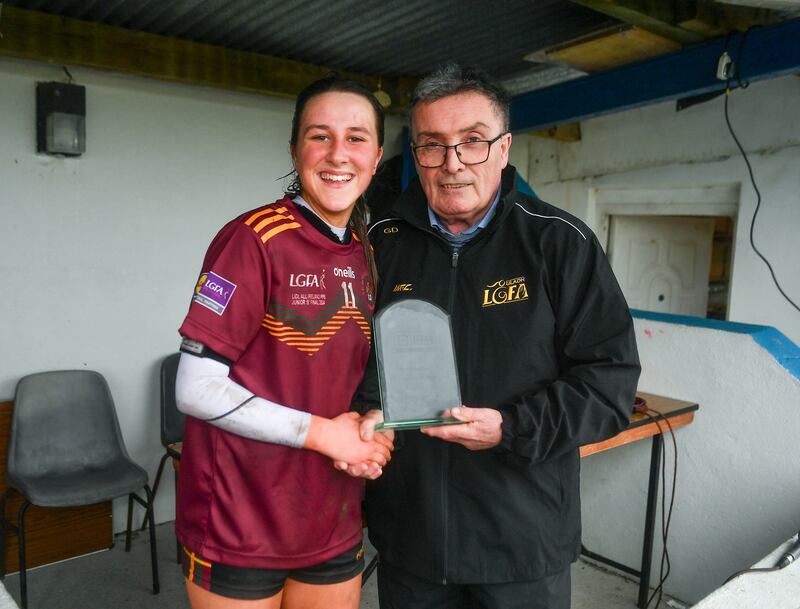 Aoibhin Donohue of St Ronan's College receives the player of the match award from LGFA representative Gerry Doherty after the 2024 Lidl All-Ireland Junior Post-Primary Schools Junior B Championship final between Presentation College Headford, Galway and St Ronans College, Lurgan, Armagh at Mullahoran in Cavan. Piture: Stephen Marken/Sportsfile